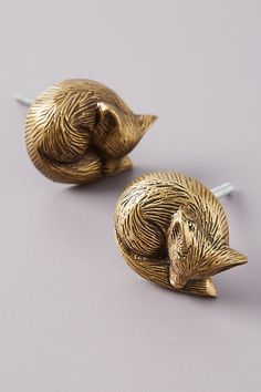 pair of gold tone metal ducky shaped earrings