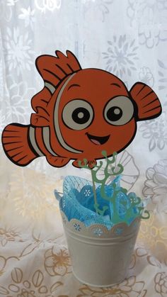 an image of a clown fish cake topper in the shape of a flower pot