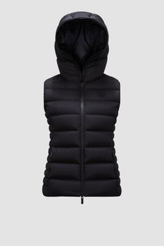 The Barraux down vest takes inspiration from the '90s with a streamlined yet sporty design. The puffer vest is crafted from longue saison,  a water-repellent nylon fabric that provides warmth while maintaining a light weight. The practical warmer is finished with a hood. Functional Fitted Nylon Puffer Jacket, Fitted Nylon Puffer Jacket Functional Style, Fitted Nylon Puffer Jacket, Fitted Nylon Puffer Jacket For Outdoor Activities, Functional Nylon Puffer Jacket For Winter Sports, Sports Windproof Nylon Puffer Jacket, Fitted Nylon Vest For Cold Weather, Nylon Vest With Padded Collar For Streetwear, Fitted Quilted Nylon Vest