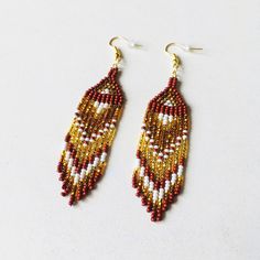 Here are bright beaded earrings with fringe. Inspired by tribal style, these seed bead earrings have a shining gradient pattern that will sparkle with every move. This pair should be in your summer jewelry collection if you love bohemian or ethnic accessories. These statement waterfall earrings will be a great addition to any evening outfit. 100% top quality handmade earrings.  Length: 3.94'' / 10 cm  Width: 0.83'' / 2,1 cm Materials:  - Czech seed beads - gold-toned stainless steel accessories. The real color of the item may be slightly different from the picture shown on website caused by the brightness of your monitor. If you have special size requirements, please send me a letter about it, as this can be made to order. More beadwork earrings: https://etsy.me/30peGhg Back to shop: https Waterfall Earrings, Gradient Pattern, Earrings Patterns, Steel Accessories, Evening Outfit, Earrings Summer, Stainless Steel Accessories, Evening Outfits, Seed Bead Earrings