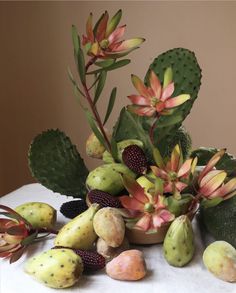 a table topped with lots of different types of flowers