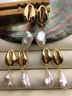 "This pearl is genuine freshwater pearl, 100% real pearl quantity: 1 pair pearl luster: high+ metal: alloy plated 14k solid gold(it's high quality) pearl shape: baroque pearl pearl color: white Back to Other Jewelry Section 01: \"Tahitian,Akoya,Sea Pearl\" Section: https://www.etsy.com/shop/WenPearls?section_id=15806339 02: \"Potato/Near Round Pearl\" Section: https://www.etsy.com/shop/WenPearls?section_id=16378067 03: \"Round Pearl\" Section: https://www.etsy.com/shop/WenPearls?section_id=16163245 04: \"Rice/Oval/Teardrop Pearl\" Section: https://www.etsy.com/shop/WenPearls?section_id=16190184 05: \"Nugget Pearl\" Section: https://www.etsy.com/shop/WenPearls?section_id=18893039 06: \"Button/Coin/Rondelle Pearl\" Section: https://www.etsy.com/shop/WenPearls?section_id=18893043 07: \"Keshi Shell-shaped Pearl Drop Earrings For Gifts, Shell-shaped Pearl Earrings For Gift, Shell-shaped Pearl Earrings With Pearl Charm, Shell-shaped Pearl Earrings Gift, Pearl Shell-shaped Earrings As Gift, Pearl Shell-shaped Earrings For Gift, Pearl Earrings With Shell Shape For Gift, Gold Mother Of Pearl Earrings With Pearl Pendant, Gold Pearl Earrings With Mother Of Pearl Pendant