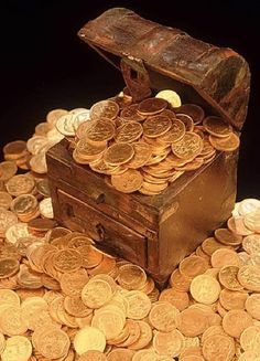 a chest full of gold coins sitting on top of a pile of other golden coins