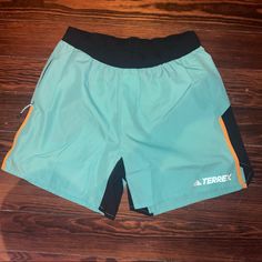 Brand New No Tags Women’s Hiking Shorts Teal/Black/Yellow Side And Back Zipper 100% Recycled Polyester Light Weight Green Athleisure Bottoms For Outdoor, Stretch Green Hiking Bottoms, Green Stretch Hiking Bottoms, Green Shorts For Hiking, Green Outdoor Bottoms With Elastic Waistband, Green Bottoms With Elastic Waistband For Outdoor, Adidas Sporty Bottoms For Outdoor Activities, Sporty Adidas Bottoms For Outdoor, Casual Adidas Outdoor Pants