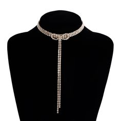 ✦ Make a dazzling entrance with our Exquisite Sparkly Rhinestones Ribbon Choker. This necklace is designed to turn heads and elevate your look. The rhinestones are intricately arranged in a ribbon pattern, reflecting light and creating a sparkling effect. The adjustable ribbon closure ensures a perfect fit, and the tassel detail adds a touch of movement and charm. Whether worn for a special occasion or to add a touch of glamour to your everyday style, this sparkly choker necklace is a must-have Elegant Alloy Necklaces For Evening, Glamorous Rhinestone Alloy Jewelry, Silver Rhinestone Necklace In Alloy, Silver Alloy Rhinestone Necklace, Crystal Rhinestone Necklace With Sparkling Stones For Party, Elegant Rhinestone Necklace In Alloy, Elegant Rhinestone Bling Necklace, Formal Alloy Rhinestone Necklaces, Adjustable Rhinestone Necklaces For Party