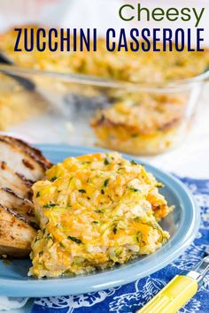 a blue plate topped with chicken and cheese casserole