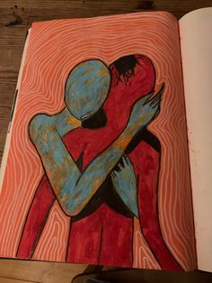 an open book with a drawing of two people hugging