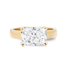 a princess cut diamond ring in yellow gold