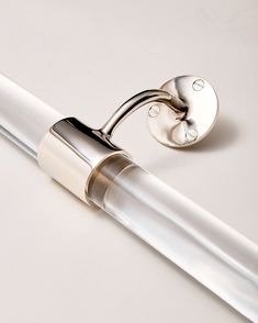 a close up of a pen on a white surface