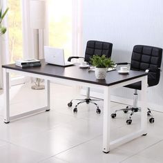 a black and white office desk with two chairs