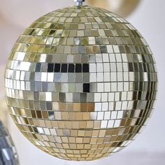 a disco ball ornament hanging from a ceiling