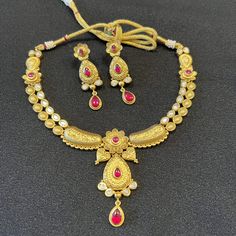 Rajwadi Kundan Ruby Necklace/ Golden Designer Temple Jewelry Necklace / Kundan Ruby Emerald Jadau Necklace/ Indian Wedding Jewelry Traditional Temple Jewelry/ Matte Gold Kundan Necklace Set Made in Brass with Matte Gold finish with Kundan Stones and Ruby stones.  Handcrafted To Perfection Light Weight Jewelry Perfect For Indian Weddings And Celebrations A Beautiful & Memorable Gift for Weddings and Special Occasions This necklace comes with Golden Thread Dori extension for flexible fitting Earri Bollywood Style Hand Set Temple Necklace For Festivals, Bollywood Style Necklaces For Eid Ceremonies, Traditional Necklaces With Intricate Design For Eid, Bollywood Style Necklaces For Eid Ceremonial, Traditional Hand Set Temple Necklace For Puja, Traditional Intricate Design Necklaces For Eid, Traditional Chandbali Bridal Necklace For Puja, Traditional Necklace With Intricate Design For Eid, Hand Set Necklaces For Wedding And Navratri