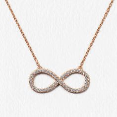 Thank your bridal party with a gift they can wear every day! This necklace features an infinity pendant on a delicate, diamond-cut cable chain. 14K Rose Gold Vermeil Hypoallergenic, lead and nickel free Pendant Width 1in(2.5cm) x Height 3/8in(1cm) Chain Length: 16-18in (40-46cm) Lobster clasp #N303 Dainty Infinity Rose Gold Necklace, Dainty Rose Gold Infinity Necklace, Hypoallergenic Rose Gold Infinity Jewelry, Infinity Cable Chain Jewelry Gift, Rose Gold Infinity Necklace For Anniversary, Infinity Necklace Gold, Infinity Pendant, Infinity Necklace, Rose Gold Necklace