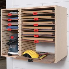 a pair of work shoes are on the shelf next to a shoe rack with numbered labels