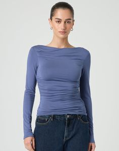 This top features longsleeves and a blackless design. Casual Elastane Blouse For Fall, Trendy Long Sleeve Tops For Layering, Chic Fitted Long Sleeve Top In Elastane, Versatile Stretch Long Sleeve Top For Night Out, Stretch Elastane Tops For Fall, Fitted Long Sleeve Elastane Tops, Versatile Fitted Long Sleeve Top For Night Out, Fitted Blue Elastane Top, Blue Fitted Elastane Top