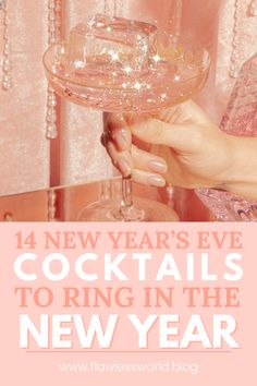 a person holding a glass with the words new year's eve cocktails to ring in the new year