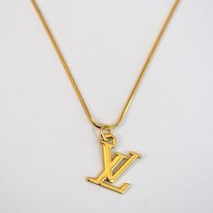 LV Logo Necklace Reluxe Vintage Lv Gold Necklace, Vintage Gold-tone Necklace With Logo Charm, Classic Gold Necklace With Logo Charm, Luxury Gold Jewelry With Logo Charm, Vintage Pendant Necklace With Logo Charm, Vintage Yellow Gold Jewelry With Logo Charm, Classic Gold Custom Necklace Tarnish Resistant, Luxury Yellow Gold Necklace With Vintage Charm, Classic Gold Custom Necklace, Tarnish Resistant