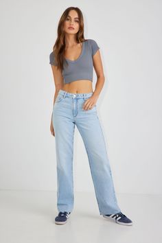 This essential 90’s look has never stopped serving. High rise and semi-fitted for a booty throwback that simply won’t quit, these straight leg jeans come in authentic non-stretch denim. We're totally replicating your favorite style from the past. Features - Five-pocket styling - Zip fly - Raw hem Size & Fit - Fit: Straight - Rise: 11" - Inseam: 32" - Model is wearing size 1 Materials & Care - Content: 75% cotton, 25% organic cotton - Care: Wash cold, inside out - Imported Best Dress Shops, Garage Clothing, Womens Jeggings, Best Jeans, Autumn Outfit, Mid Rise Jeans, Retro Look, Simple Outfits, Vintage Denim