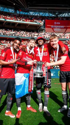 the manchester united team pose with the fa cup