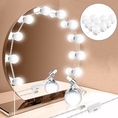 an image of a vanity mirror with lights on it in the shape of a ball