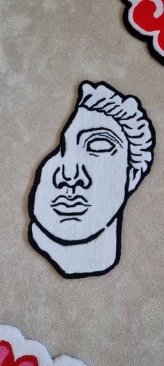 a close up of a person's face on a rug with hearts in the background