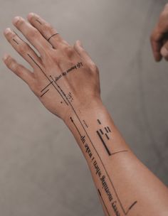 a person's arm with lines on it and the words written in black ink