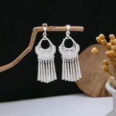 Material: Alloy Fashion Element: Circle, Triangle, Ellipse Style: Ethnic Style Silver Fringe Metal Earrings, Silver Dangle Tassel Earrings, Silver Fringe Drop Earrings, Silver Dangle Tassel Earrings With Fringe, Silver Dangle Earrings With Tassels, Silver Fringe Chandelier Drop Earrings, Silver Metal Chandelier Earrings With Tassels, Bohemian Metal Tassel Earrings With Fringe, Traditional Fringe Drop Earrings