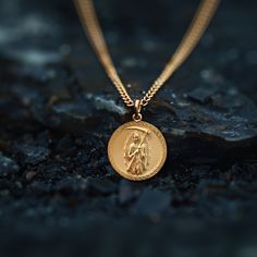 Our Gold Santa Muerte Pendant, crafted in the USA from real solid gold, embodies devotion and protection. This timeless piece showcases exquisite craftsmanship, designed to last a lifetime. Perfect for those seeking a unique and meaningful symbol, this pendant is a testament to enduring quality and elegance. PENDANT INFORMATIONThis pendant is made of real, solid gold.• Made in USA• Material: 14k or 18k solid gold• Finish: polished• Height: 1.13" (29 mm) x Width: 1" (26 mm)• Pendant weight: appro Spiritual Recycled Gold Tarnish-resistant Jewelry, Spiritual Yellow Gold Jewelry With Adjustable Chain, Tarnish Resistant 14k Gold Chain Necklace With Round Pendant, 14k Gold Tarnish Resistant Chain Necklace With Round Pendant, 14k Rose Gold Chain Necklace With Round Pendant, Spiritual 14k Gold Round Pendant Jewelry, 14k Gold Spiritual Round Pendant Jewelry, Spiritual 14k Gold Round Pendant, Spiritual 14k Gold Jewelry With Adjustable Chain