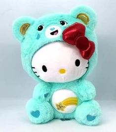 a hello kitty stuffed animal with a bow on its head