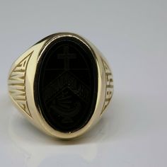 10K Yellow Gold 1950 School Ring, oval engraved black onyx plaque with cross and lamp, 5/8 inch across, bright polish, Ring size 5, Circa 1950, 7.5 grams SKU # BB272R24 Most rings are sizable for a small fee. If the ring you are considering is the incorrect size contact us for a quote. This listing contains photographs of the actual item you will receive. Our items are in excellent condition with little or no signs of wear and many are one of a kind pre-owned estate finds. Please look closely at Classic Polished Signet Ring For Commemoration, Engraved Oval Signet Ring For Commemoration, Classic Oval Signet Ring Collectible, Classic Engraved Ring With Polished Finish For Commemoration, 14k Gold Oval Signet Ring For Commemoration, Oval 14k Gold Signet Ring For Commemoration, Classic Oval Black Enamel Signet Ring, Black 14k Gold Engraved Signet Ring, Oval Hallmarked Signet Ring For Commemoration