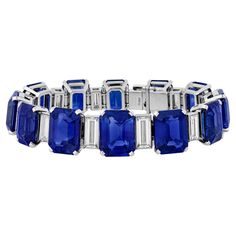 This stunning bracelet features a monumental 85.53 carats of vivid royal blue Ceylon sapphires, each certified by the GRS as hailing from its prestigious origin. Designed by esteemed Swiss jewelers Chopard, this bracelet makes a bold yet elegant statement on the wrist, exuding timeless luxury. The intense blue of the sapphires is perfectly accented by 7.00 carats of baguette cut white diamonds, all set classically in platinum. This magnificent bracelet also comes in its original Chopard box. Signed "Chopard" 6 1/2" length Ceylon Sapphire Ring, Dream Bracelet, Modern Bracelets, Antique Bracelets, Modern Engagement Rings, Timeless Luxury, Ceylon Sapphire, Purple Sapphire, Mesh Bracelet