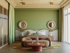 a bedroom with green walls and furniture in it