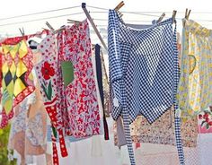 many colorful clothes are hanging on the clothesline