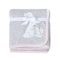 a baby blanket with a white bunny and pink polka dot design on the bottom,