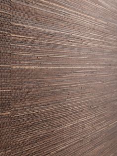 a close up view of a wall made out of woven fabric and wood planks