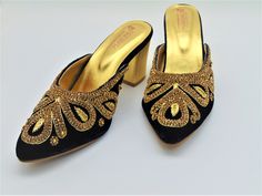 Our new collection of designer wedding shoes which we offer for you. These beautiful shoes are navy blue with zardozi work on velvet embroidered all around the shoe and round front shaped. These are extremely comfortable wedding shoes with a low heel these are comfortable to wear for long hours. These are perfect for your wedding or a formal event. These bridal shoes offer a heel size of 3 Inches. Don't miss out on these beauties! See our page for more of our collection! We ship out in a timely Gold Slip-on Heels For Wedding, Formal Embellished Heels For Festive Occasions, Traditional High Heel Festive Heels, Traditional High Heel Evening Heels, Traditional Closed Toe Evening Heels, Traditional Party Heels With Gold Embroidery, Traditional High Heels For Evening, Traditional High Heels For Festive Occasions, Traditional Evening Heels