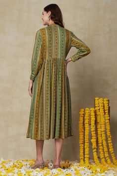 This ethnic outfit and shrug ensemble is the perfect marriage of traditional Indian craftsmanship and modern fashion. Made of breathable fabrics and adorned with intricate mirror work details and tassels, it combines comfort and style in a timeless classic. This Fusion Wear Green Outfit with Shrug is perfect for a casual, comfortable look. Its fabric is designed to provide superior fit and comfort, while its neat tailoring ensures a flawless look. Make a timeless fashion statement in this exquis Bohemian Chanderi Anarkali Set For Eid, Festive Kurta With Back Tassel Tie-up For Eid, Festive Straight Kurta With Tassels, Festive Kurta With Tassels, Traditional Designer Kurta With Back Tassel Tie-up, Navratri Straight Kurta Anarkali Set With Tassels, Designer Bohemian Kurta For Navratri, Bohemian Designer Kurta For Navratri, Festive Bollywood Kurta With Tassels