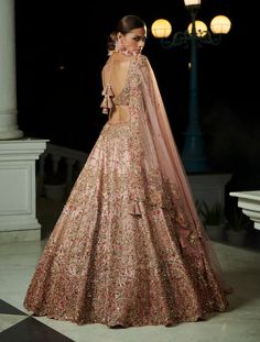 Editor's Note The blush peach raw silk bridal lehenga set comes with a matching raw silk embroidered blouse and two tulle dupattas. The lehenga is adorned with gold and thread embroidery, adding a touch of elegance and sophistication to the overall look. Fabric: Raw silk and tulle Color: Blush peach Components: Lehenga, blouse and two dupattas Occasion: Reception Disclaimer: Product color may slightly vary due to photographic lighting sources or your monitor setting. Care: Dry clean only About t Lehanga Bridal, Silk Bridal Lehenga, Dolly J, Embroidered Bridal Lehenga, Peach Lehenga, Wedding Dresses Indian, Reception Lehenga, Red Lehenga, Indian Bridal Dress