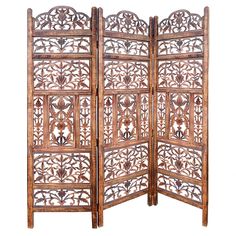 an intricately carved wooden room divider