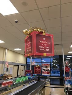 a christmas and new year's gift hanging from the ceiling in a grocery store