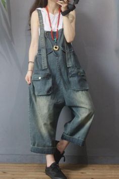 #jeans #overalls #dungarees #relaxfit Utility Dark Wash Denim Jumpsuit With Pockets, Casual Denim Cargo Jumpsuit, Casual Denim Cargo Style Jumpsuit, Vintage Baggy Cargo Jeans With Pockets, Casual Cargo Jeans Overalls, Dark Wash Wide Leg Overalls With Pockets, Wide Leg Dark Wash Overalls With Pockets, Utility Overalls With Side Pockets And Loose Fit, Casual Denim Jumpsuit With Patch Pockets And Relaxed Fit