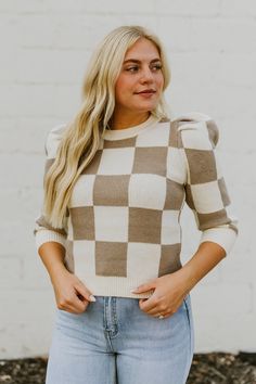 Our Checker Knit Sweater is made with cute puff sleeves and is available in Taupe. It has a ribbed crew neckline, hem, and cuffs. Made with: 52% ACRYLIC 35%COTTON 13% POLYESTER Available in women's sizes Small, Medium, and Large. Cozy Puff Sleeve Tops For Fall, Chic Ribbed Puff Sleeve Sweater, Fall Puff Sleeve Sweater With Ribbed Cuffs, Knit Puff Sleeve Top For Winter, Trendy Puff Sleeve Sweater With Ribbed Cuffs, Fall Casual Puff Sleeve Sweater, Puff Sleeve Ribbed Sweater For Fall, Ribbed Puff Sleeve Sweater For Fall, Fall Ribbed Puff Sleeve Sweater