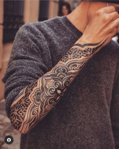 a man with a tattoo on his arm