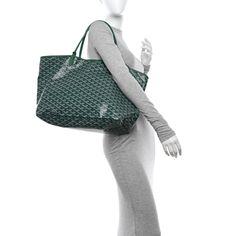 This is an authentic GOYARD Goyardine Saint Louis GM in Green. This stylish tote is crafted of traditional Goyard chevron print canvas in green. The bag features sturdy leather shoulder straps and matching trim. The top is open to a spacious canvas interior with a matching removable pouch. Goyard Tote, Neutral Fabric, Chevron Print, Saint Louis, Green Leather, St Louis, Shoulder Straps, Patch Pocket, Pouch