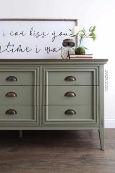 a green dresser with drawers and a sign above it that says i can't miss you