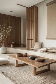 a living room filled with furniture and a wooden table in front of a wall mounted mirror