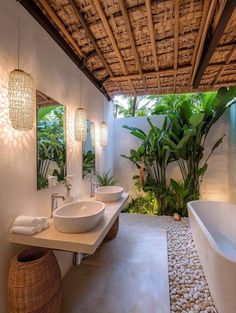 a bathroom with two sinks and a bathtub