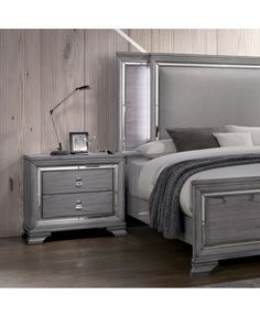 a bedroom scene with focus on the bed and nightstands that have been placed side by side