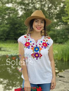 This Beautiful Floral Hand Embroidered Blouse is the perfect Top for Everyday use or a special event. This blouse is hand embroidered by Mexican Artisans and is completely one of a kind! This blouse comes in one size which fits sizes Small and Medium. More Colors Available here: https://www.etsy.com/es/listing/834786779/blusa-floral-bordado-a-mano-blusa-floral?ref=listing_published_alert Bohemian Embroidered Top With Multicolor Floral Design, Bohemian Embroidered Top With Multicolor Floral Embroidery, Bohemian Multicolor Floral Embroidered Top, Folk Style Embroidered Top For Vacation, Bohemian Embroidered Top For Beach With Geometric Embroidery, Bohemian Tops With Intricate Embroidery For Vacation, Bohemian Floral Embroidered Top For Beach, Bohemian Embroidered Festival Top, Bohemian Embroidered Top For Beach