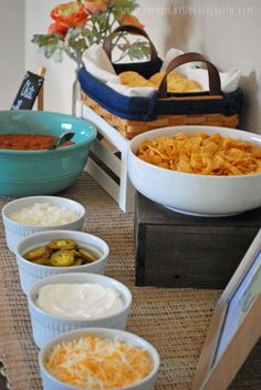 several bowls of food are on a table